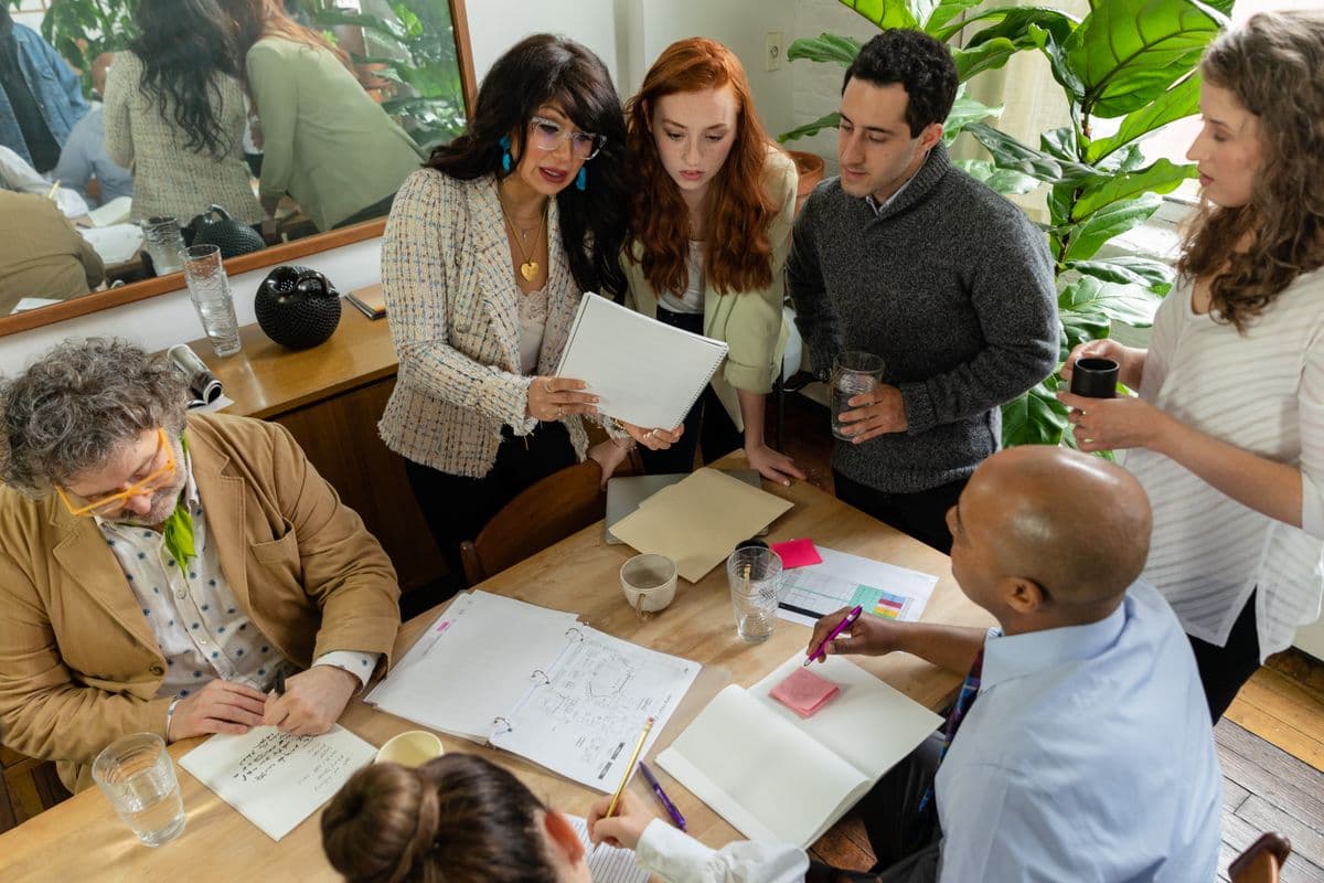 A team working through case plans together around a table